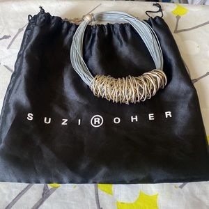 Statement necklace. Wrapped silver on gray cord